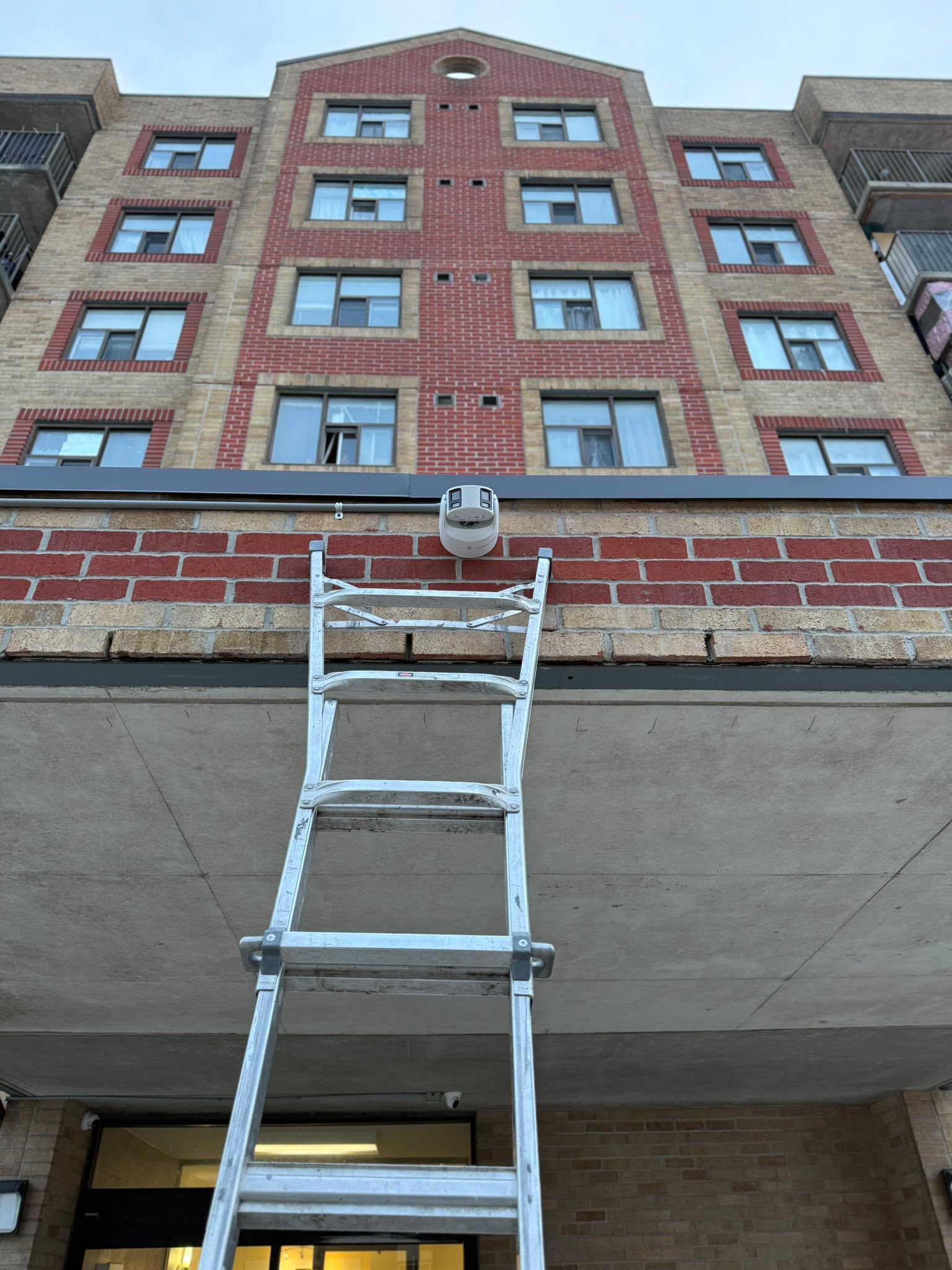 Security camera installation on multi-storey residential building